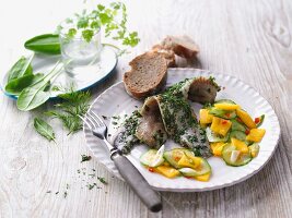 Herb soused herring with a fruity cucumber salad