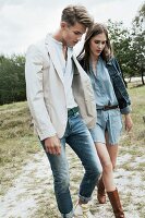 A young couple wearing casual clothing going for a walk