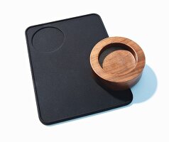 A tamping mat and a nutwood tamper