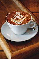 Coffee with a milk foam pattern