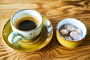 An espresso and cane sugar lumps