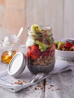 Crispy chia pudding with fruits in a jar