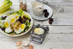 Mediterranean egg salad with olives and courgette strips