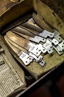 Blank knife blades in a box