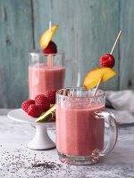 Fig and raspberry smoothies with pineapple, peaches and chia seeds