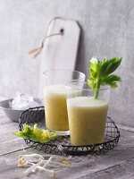 Orange and grapefruit smoothies with pineapples, celery and beansprouts