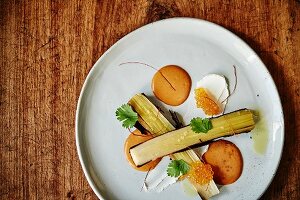 Grilled leeks with coriander, salmon caviar, roasted squash purée and chilli threads