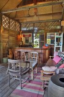 Bar in wood and bamboo cabin with lounge furniture, Langkawi, Malaysia