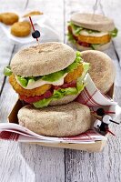 Vegan muffins with houmous, tomatoes and lettuce