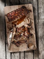 Spare ribs with an oriental marinade on a wooden board