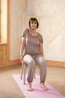 Shoulder raises (yoga) – Step 1: sit and raise right shoulder