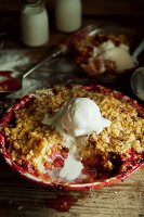 Almond and berry crumble with vanilla ice cream