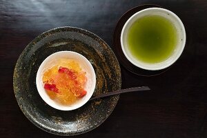 Kaiseki menu: fruit jelly with strawberries and green tea