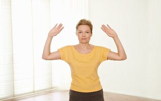Breathing regulation (Tiaoxi, Qigong) – Step 3: bring hands to the side