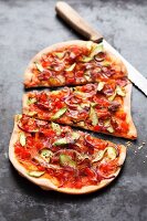 Tarte flambée with tomatoes and green asparagus