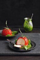 Tomato mousse coated in jelly with basil pesto