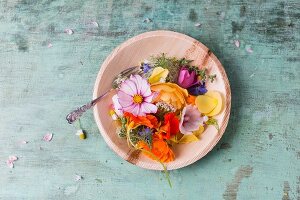 Various edible summer flowers on plate