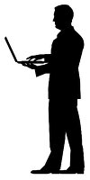 A silhouette of a man in business clothes with a laptop