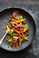 Salad of curer veal tongue with lentils, carrot and celery