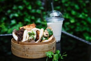 Asian-style street food in a bamboo steamer