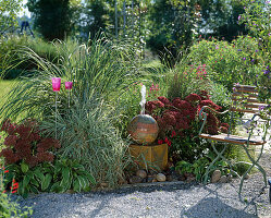 Installing water feature in the garden, flowerbed with water feature