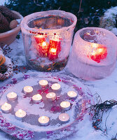 Ice lanterns with frozen cyclamen flowers