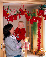 Advent calendar of red, filled little bags with numbers