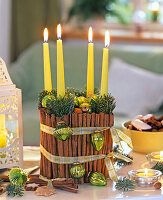 Christmas wreath with glass and cinnamon sticks (green candles)