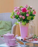 Bouquet made of ranunculus and viburnum (snowball)