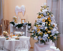Christmas room in white and gold with Abies nordmanniana