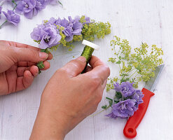 Delphinium lady's mantle wreath around lanterns