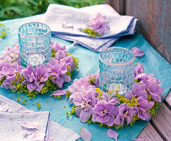 Delphinium lady's mantle wreath around lanterns