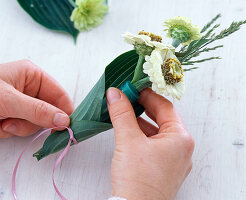 Small bouquet in hosta leaf