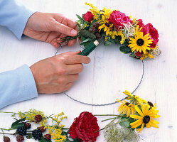 Wreath with red roses and Rudbeckia (2/3)