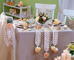 Table decoration with Dianthus, Pinus, Rosa