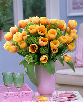 Bouquet of Tulipa (tulips) with open flowers and Viburnum (snowball)