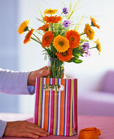 Bouquet of marigolds in gift bag (1/2)