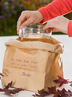 Bouquet made of leaves in paper bag with poem