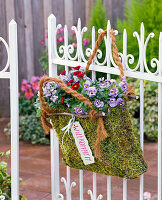 Moss bag with spring flowers