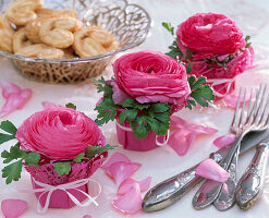 Ranunculus in a cake topping glass