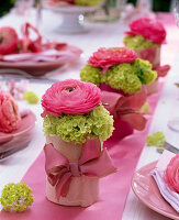 Small ranunculus and viburnum arrangements