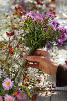 Table decoration with asters and roses