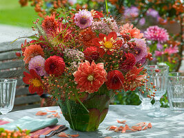 Dahlia bouquet in leaf vase