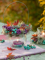 Lantern with purple and turquoise berries