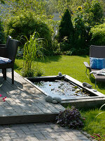 Building a mini pond from a flowerbed with wooden edging 4/4