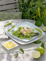 Fried fish fillet on Asian lettuce