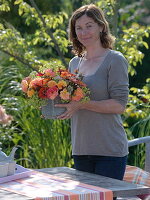 Woman with late summer bouquet