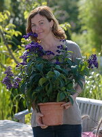 Woman with vanilla flower in tub