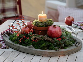 Candle in clay pot with moss-bark wreath