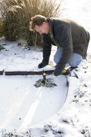 Man hits hole in frozen pond